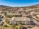 Aerial view of a community with multiple residential buildings and a mountain backdrop at 225 Big Horn Dr # 5, Boulder City, NV 89005