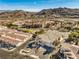 Aerial view of a residential property with a two-car garage and surrounding homes at 225 Big Horn Dr # 5, Boulder City, NV 89005