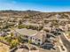 Aerial view showcasing a residential building among other homes, with hills in the background at 225 Big Horn Dr # 5, Boulder City, NV 89005