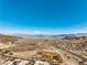 An expansive aerial view featuring a lake, mountains, and a residential area at 225 Big Horn Dr # 5, Boulder City, NV 89005