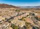 Aerial view of a home near a lake, showcasing the property and surrounding landscape at 225 Big Horn Dr # 5, Boulder City, NV 89005