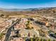 Aerial view of a home with lake and mountain views in the background at 225 Big Horn Dr # 5, Boulder City, NV 89005