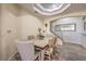 Casual dining area with a wood table and six chairs near kitchen at 225 Big Horn Dr # 5, Boulder City, NV 89005