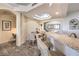 Bright dining area with a wood table and four chairs, adjacent to kitchen at 225 Big Horn Dr # 5, Boulder City, NV 89005