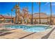 Community pool with surrounding patio and landscaping at 225 Big Horn Dr # 5, Boulder City, NV 89005