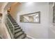 Elegant interior staircase with a large mirror at 225 Big Horn Dr # 5, Boulder City, NV 89005