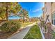 Landscaped walkway with green grass and trees at 225 Big Horn Dr # 5, Boulder City, NV 89005