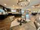 Bright dining area with a farmhouse style table and chandelier at 2250 Shaw Cir, Las Vegas, NV 89117