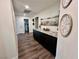 Long hallway with dark cabinets and granite countertop at 2250 Shaw Cir, Las Vegas, NV 89117