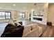 Living room featuring a modern fireplace and gray sectional sofa at 2250 Shaw Cir, Las Vegas, NV 89117