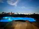 Inviting pool and spa at night with blue lighting at 2250 Shaw Cir, Las Vegas, NV 89117