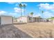 Backyard view showing home, shed, and open space at 2318 Howard Dr, Las Vegas, NV 89104