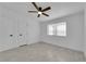 Bright bedroom with ceiling fan and wood-look floors at 2318 Howard Dr, Las Vegas, NV 89104