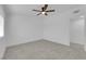 Simple bedroom with ceiling fan and wood-look floors at 2318 Howard Dr, Las Vegas, NV 89104