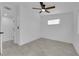 Simple bedroom with ceiling fan and wood-look floors at 2318 Howard Dr, Las Vegas, NV 89104