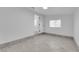 Spacious bedroom with gray wood-look flooring and an ensuite bathroom at 2318 Howard Dr, Las Vegas, NV 89104