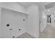 Clean laundry room with built-in shelving and a hallway view at 2318 Howard Dr, Las Vegas, NV 89104