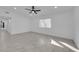 Spacious living area with wood-look tile floors and ceiling fan at 2318 Howard Dr, Las Vegas, NV 89104