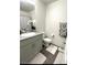 Modern bathroom with gray vanity and updated fixtures at 2853 Tahiti Grape Way # 3, Las Vegas, NV 89183