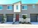 Modern two-story townhome with attached garage and landscaping at 2853 Tahiti Grape Way # 3, Las Vegas, NV 89183