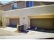 Two-car garage with exterior access and AC unit at 2853 Tahiti Grape Way # 3, Las Vegas, NV 89183