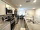 Modern kitchen with stainless steel appliances and granite countertops at 2853 Tahiti Grape Way # 3, Las Vegas, NV 89183