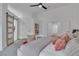 Bright bedroom featuring a sliding barn door and plush carpet at 3105 Siena Cir, Las Vegas, NV 89128