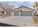 Two car garage and front yard landscaping at 3105 Siena Cir, Las Vegas, NV 89128