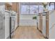 Modern kitchen with stainless steel appliances and light wood flooring at 3105 Siena Cir, Las Vegas, NV 89128