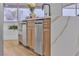 Modern kitchen island with white quartz countertop and stainless steel appliances at 3105 Siena Cir, Las Vegas, NV 89128