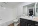 Bathroom features a bathtub, toilet and vanity at 312 Crosswind Way, Las Vegas, NV 89145