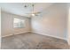 Spacious bedroom with ceiling fan and gray carpeting at 312 Crosswind Way, Las Vegas, NV 89145