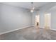 Primary bedroom with ceiling fan and en-suite bathroom at 312 Crosswind Way, Las Vegas, NV 89145