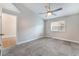 Bright bedroom with ceiling fan and gray carpeting at 312 Crosswind Way, Las Vegas, NV 89145