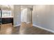 Hallway with wood-look flooring leading to the kitchen and other rooms at 312 Crosswind Way, Las Vegas, NV 89145