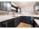 Modern kitchen with stainless steel appliances and dark cabinets at 312 Crosswind Way, Las Vegas, NV 89145