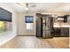 Modern kitchen with stainless steel appliances and dark cabinets at 312 Crosswind Way, Las Vegas, NV 89145