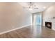 Living room with fireplace, wood-look floors and sliding glass doors at 312 Crosswind Way, Las Vegas, NV 89145