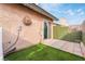 Private patio with artificial turf and block wall at 312 Crosswind Way, Las Vegas, NV 89145