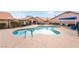 Community pool with surrounding patio and chairs at 312 Crosswind Way, Las Vegas, NV 89145