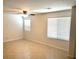 Bright living room with tile floors and ceiling fan at 3513 Golden Chariot Ave, Las Vegas, NV 89106