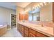 Bathroom with double vanity, large mirror, and updated tile at 3540 E Burgundy Dr, Pahrump, NV 89048