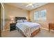 Bright bedroom with a queen-size bed, nightstands, and ample natural light at 3540 E Burgundy Dr, Pahrump, NV 89048