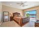 Main bedroom with sliding glass doors leading to a pool view at 3540 E Burgundy Dr, Pahrump, NV 89048