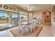 Bright dining room with sliding doors leading to the backyard at 3540 E Burgundy Dr, Pahrump, NV 89048