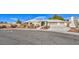 Single-story house with a large driveway and landscaped yard at 3540 E Burgundy Dr, Pahrump, NV 89048