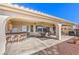 Large covered patio with bar and multiple seating areas at 3540 E Burgundy Dr, Pahrump, NV 89048