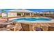 Relaxing kidney-shaped pool with flagstone patio at 3540 E Burgundy Dr, Pahrump, NV 89048