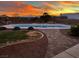 Relaxing kidney-shaped pool at sunset at 3540 E Burgundy Dr, Pahrump, NV 89048