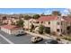 Two-story building complex with red tile roofs, parking, and mountain backdrop at 3810 Desert Marina Dr # 198, Laughlin, NV 89029